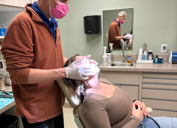 Dr. Erik Reitter performing a TMJ consultation on patient