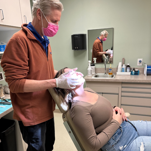 Dr. Erik Reitter performing a TMJ consultation on patient