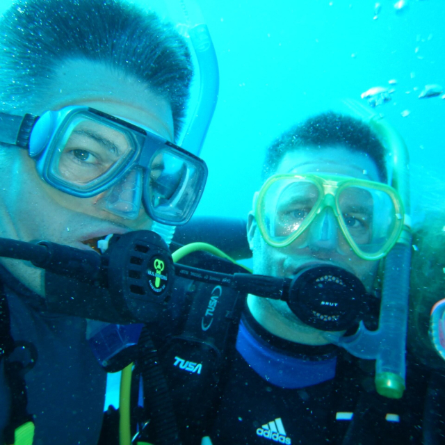 Close up image of Dr. Ryhn diving with another person.