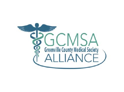 Caduceus symbol with serpents and wings, beside "GCMSA Greenville County Medical Society Alliance" text. Logo combines medical imagery and organizational name.