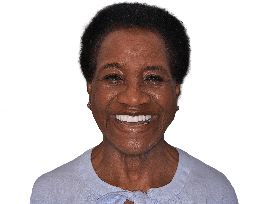 A smiling person wearing a light blue shirt is isolated on a white background, conveying a sense of happiness and positivity.