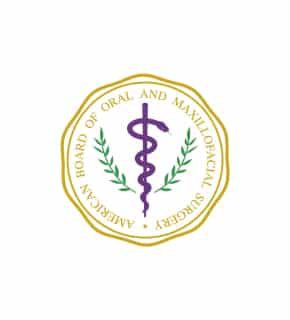 The image features the American Board of Oral and Maxillofacial Surgery emblem, displaying a purple caduceus entwined with green branches within a gold border.