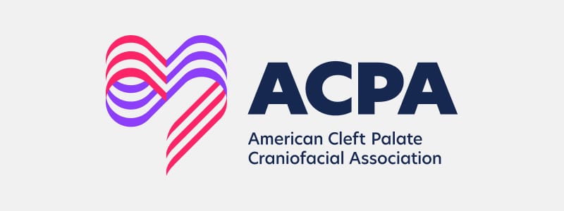 ACPA logo featuring a stylized heart in pink and purple with text "American Cleft Palate Craniofacial Association" on a light background.