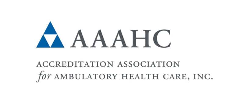 Blue triangle, bold text "AAAHC", followed by "Accreditation Association for Ambulatory Health Care, Inc." on a white background. Simple and professional design.